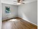 Bedroom with ceiling fan, hardwood floors, and a bright window at 3867 Cherie Glen Rd, Snellville, GA 30039