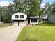 Charming two-story home with a well-manicured lawn and two-car garage offering curb appeal at 3867 Cherie Glen Rd, Snellville, GA 30039