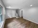 Bright living room featuring hardwood floors, large windows, and staircase access at 3867 Cherie Glen Rd, Snellville, GA 30039