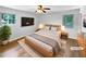 Comfortable main bedroom featuring two windows for natural light and stylish, staged decor at 3867 Cherie Glen Rd, Snellville, GA 30039