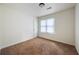 A well-lit empty bedroom with neutral walls and floors, ready for personalization at 183 Peachtree Ct, Riverdale, GA 30274
