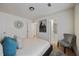 Bedroom featuring art, a gray chair, and an ensuite bathroom at 183 Peachtree Ct, Riverdale, GA 30274