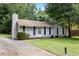 Charming single-story home featuring a well-maintained lawn, cozy front porch and a classic exterior at 183 Peachtree Ct, Riverdale, GA 30274