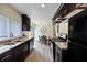 Modern kitchen features stainless steel appliances, granite countertops, and a dining area at 183 Peachtree Ct, Riverdale, GA 30274