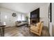 Comfortable living room featuring a stone fireplace, modern furnishings, and natural light at 183 Peachtree Ct, Riverdale, GA 30274
