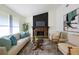 Bright living room with a stone fireplace, comfortable seating, and neutral color palette for a cozy feel at 183 Peachtree Ct, Riverdale, GA 30274