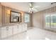Bathroom featuring a vanity with marble countertop and patterned wallpaper at 5190 Due West Nw Rd, Powder Springs, GA 30127