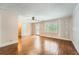 Bedroom with hardwood floors, ceiling fan, and access to the backyard at 5190 Due West Nw Rd, Powder Springs, GA 30127