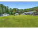 A home with an expansive, well-manicured lawn and multiple outbuildings at 5190 Due West Nw Rd, Powder Springs, GA 30127