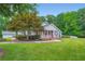 Charming single story home with a lush green lawn and meticulously maintained landscaping at 5190 Due West Nw Rd, Powder Springs, GA 30127