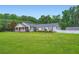 Charming single story home featuring a lovely lawn and a welcoming front porch at 5190 Due West Nw Rd, Powder Springs, GA 30127