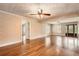 Large living room with hardwood floors, decorative wallpaper, and natural light at 5190 Due West Nw Rd, Powder Springs, GA 30127