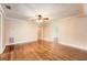 Open living room with hardwood floors and decorative wallpaper at 5190 Due West Nw Rd, Powder Springs, GA 30127