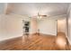 Spacious living room with hardwood flooring and decorative wallpaper at 5190 Due West Nw Rd, Powder Springs, GA 30127