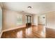 Hardwood floors, plantation shutters and a decorative front door feature in this living room at 5190 Due West Nw Rd, Powder Springs, GA 30127