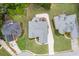 Aerial view showcases the home's layout, private backyard, and expansive driveway and roof at 995 Lewis Ridge Cir, Lawrenceville, GA 30045