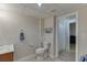 Bright bathroom with white toilet and a partially visible shower at 995 Lewis Ridge Cir, Lawrenceville, GA 30045