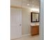Bathroom featuring a wood vanity with a mirror and light fixture at 995 Lewis Ridge Cir, Lawrenceville, GA 30045