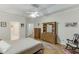 Well-appointed bedroom featuring hardwood floors, traditional furnishings, and an ensuite bathroom at 995 Lewis Ridge Cir, Lawrenceville, GA 30045