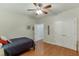 Bedroom offers a ceiling fan, wood floors, lots of natural light, and neutral colored walls at 995 Lewis Ridge Cir, Lawrenceville, GA 30045