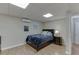Cozy bedroom in finished basement with hardwood floors, soft lighting, and doorway to next room at 995 Lewis Ridge Cir, Lawrenceville, GA 30045