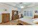 Relaxing bedroom featuring hardwood floors, a ceiling fan, and traditional furnishings at 995 Lewis Ridge Cir, Lawrenceville, GA 30045