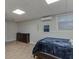 Cozy bedroom featuring modern fixtures and a sleek, dark dresser at 995 Lewis Ridge Cir, Lawrenceville, GA 30045