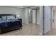 A comfy bedroom with a view of a hall features light-colored wood floors at 995 Lewis Ridge Cir, Lawrenceville, GA 30045