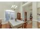 Bright and airy dining room with a large window, hardwood floors, and traditional furniture at 995 Lewis Ridge Cir, Lawrenceville, GA 30045