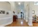Inviting hallway with gleaming hardwood floors, high ceilings, and elegant trim work at 995 Lewis Ridge Cir, Lawrenceville, GA 30045
