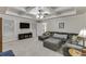 Living room in the finished basement boasting a coffered ceiling, large sectional sofa, and TV at 995 Lewis Ridge Cir, Lawrenceville, GA 30045
