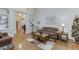 Spacious living room with hardwood floors, comfortable seating, and bright natural light at 995 Lewis Ridge Cir, Lawrenceville, GA 30045