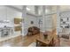 Open-concept living space with built-in shelving, neutral colors, and hardwood flooring at 995 Lewis Ridge Cir, Lawrenceville, GA 30045