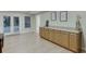Finished basement with countertop, cabinets, and French doors leading to the backyard at 995 Lewis Ridge Cir, Lawrenceville, GA 30045
