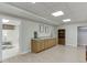 Bright finished basement features wood-look floors, cabinets, and doorways to other rooms at 995 Lewis Ridge Cir, Lawrenceville, GA 30045