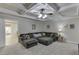Finished basement featuring plush carpeting, comfortable sectional sofa, and coffered ceiling at 995 Lewis Ridge Cir, Lawrenceville, GA 30045
