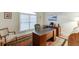 Bright home office with ample desk space, natural light, and traditional decor at 995 Lewis Ridge Cir, Lawrenceville, GA 30045