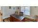 Functional office space with large desk, area rug, and a comfortable accent chair at 995 Lewis Ridge Cir, Lawrenceville, GA 30045