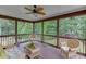 Relaxing sunroom with wicker furniture and a ceiling fan at 995 Lewis Ridge Cir, Lawrenceville, GA 30045