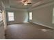 Spacious bedroom with plush carpeting and natural light from two windows at 5311 Tuscany Dr, Douglasville, GA 30135