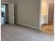 Spacious bedroom with carpeted floor, adjoining bathroom, and a glimpse of a modern kitchen at 5311 Tuscany Dr, Douglasville, GA 30135