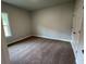 Bedroom featuring neutral paint and plush carpet, complemented by a large window at 5311 Tuscany Dr, Douglasville, GA 30135