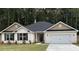Charming one-story home with a two-car garage, brick facade, and well-manicured lawn at 5311 Tuscany Dr, Douglasville, GA 30135