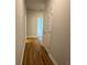 Hallway with hard surface floors, grey paint, and white trim and doors at 5311 Tuscany Dr, Douglasville, GA 30135