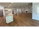 Open concept living room with large kitchen island and fireplace at 5311 Tuscany Dr, Douglasville, GA 30135