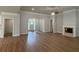 Open living room with hardwood floors, fireplace, and ample natural light at 5311 Tuscany Dr, Douglasville, GA 30135