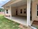 Covered patio area with white columns and ample space for outdoor furniture at 5311 Tuscany Dr, Douglasville, GA 30135