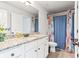 Modern bathroom with granite countertop, double sink and blue decorative shower curtain at 125 Atkins Ln, Fayetteville, GA 30215