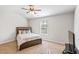 Cozy bedroom with ceiling fan, carpeted floors and a large window at 125 Atkins Ln, Fayetteville, GA 30215