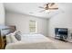 Comfortable bedroom with ceiling fan, carpeted floors, and large window at 125 Atkins Ln, Fayetteville, GA 30215